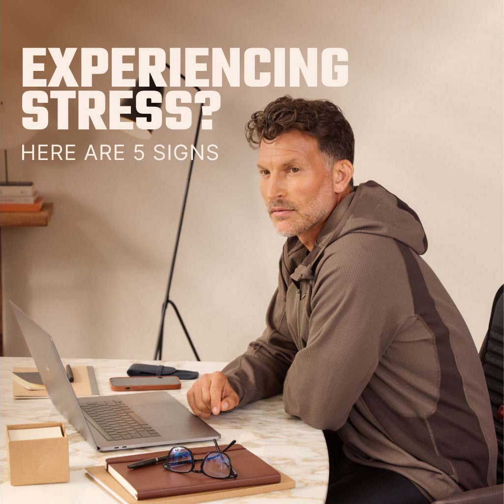 Man Sitting at Desk with Laptop